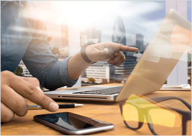 A smiling creative author at Prestige Publishings brainstorming book ideas with a notebook and pen.